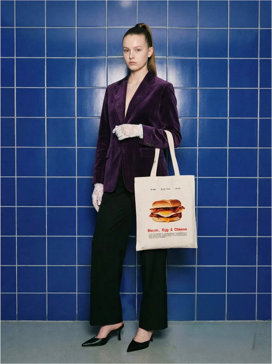 Burnt Totes editorial — model holding the B.E.C. tote